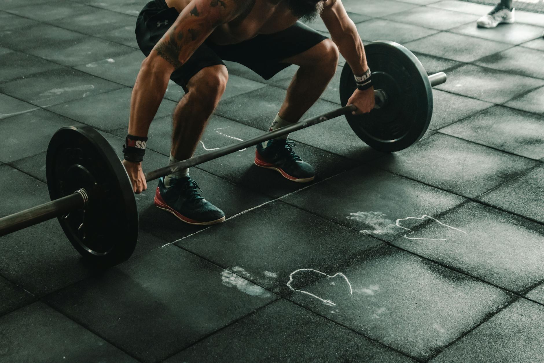 man about to lift barbell